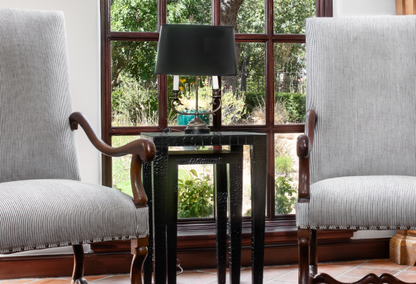 two chairs and desk beside window